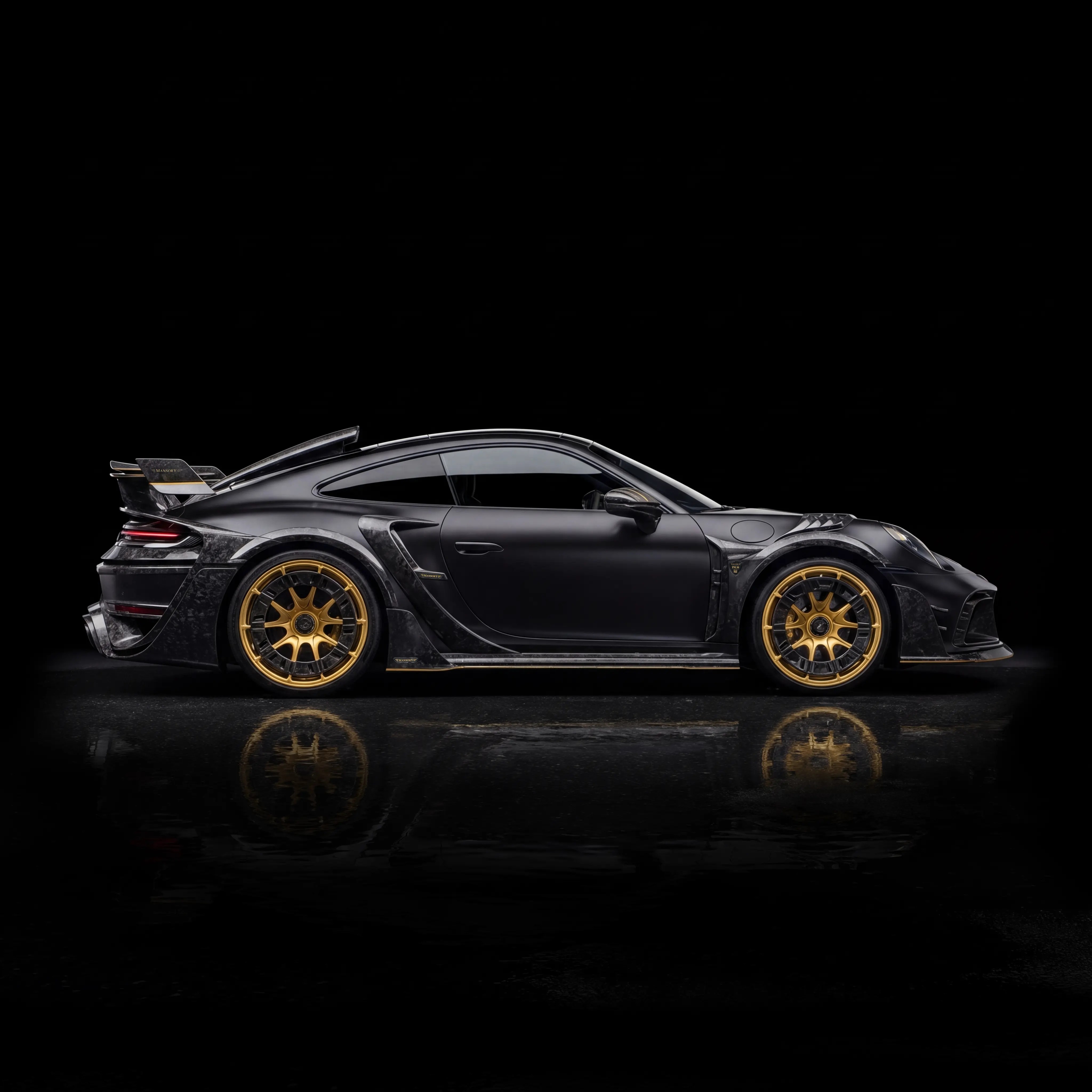 Black MANSORY sports car with gold forged wheels in a dark studio